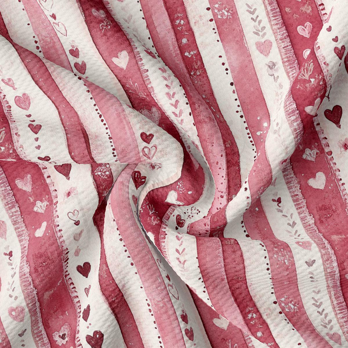a close-up view of a fabric with a repeating pattern of pink and white stripes, along with small heart shapes scattered throughout the fabric.