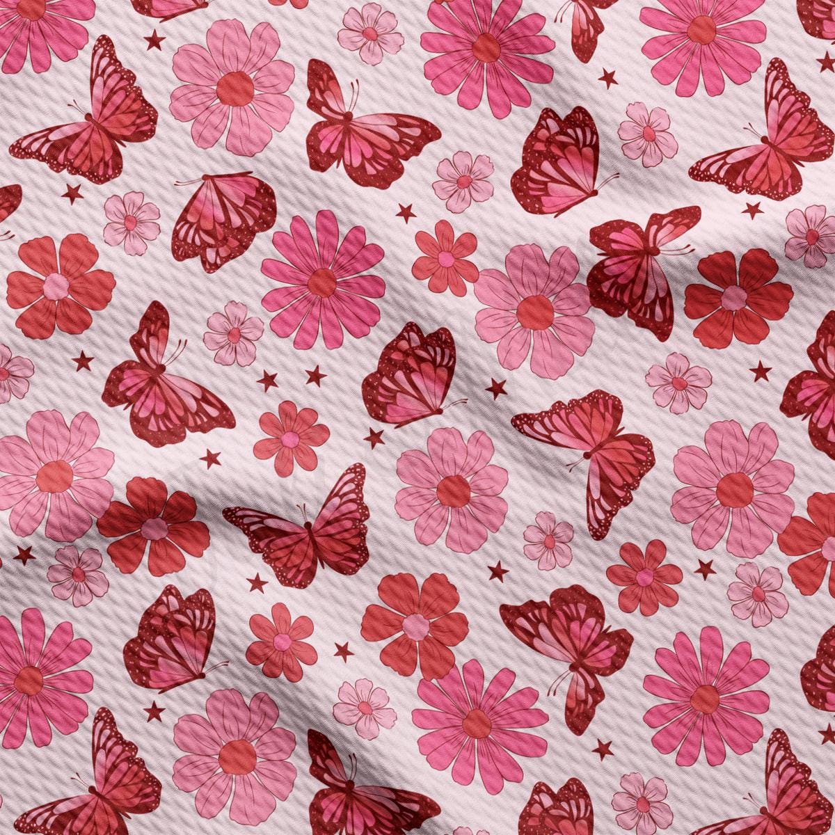 a pink and red flower and butterfly print fabric