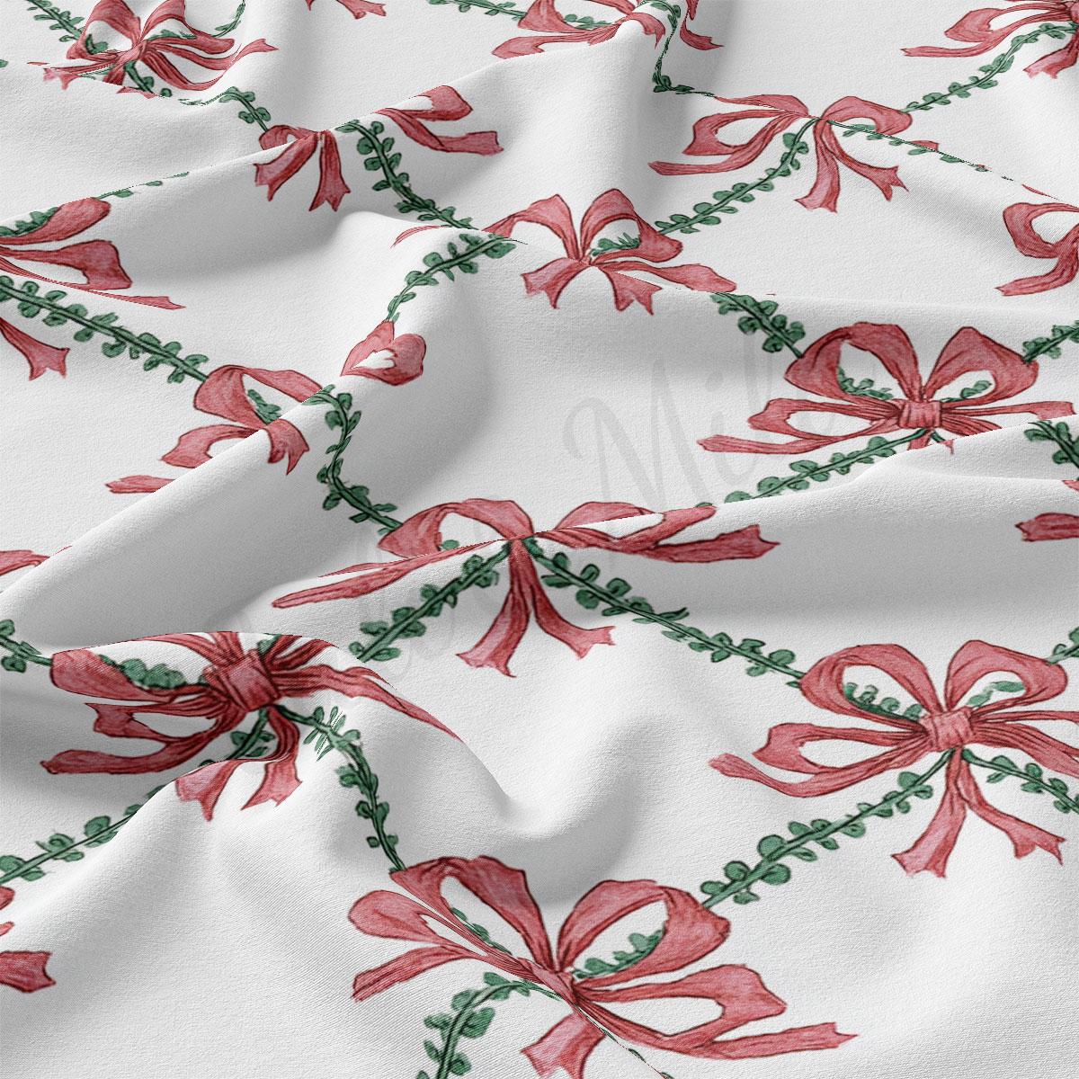 a close-up view of a fabric with a repeating pattern of red bows and green leaves. The bows are arranged in a diagonal pattern, creating a sense of movement and dynamism across the fabric. The green leaves add a touch of natural beauty to the overall design.