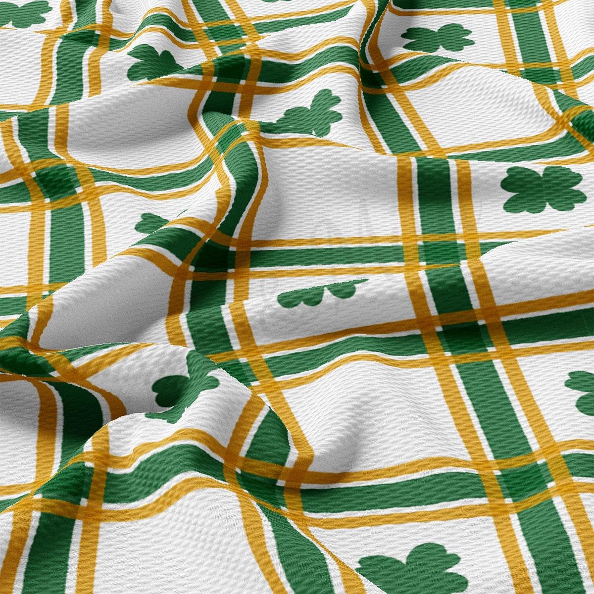 a green and yellow plaid with shamrocks on it