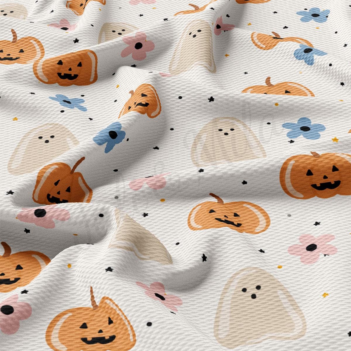 a white fabric with a playful Halloween-themed pattern. It includes various Halloween-related elements such as pumpkins, ghosts, and flowers. The pumpkins are depicted in different sizes and colors, while the ghosts are shown in a variety of shapes and sizes. The flowers are scattered throughout the fabric, adding a touch of whimsy to the overall design. The fabric appears to be crumpled, giving it a soft and cozy appearance.