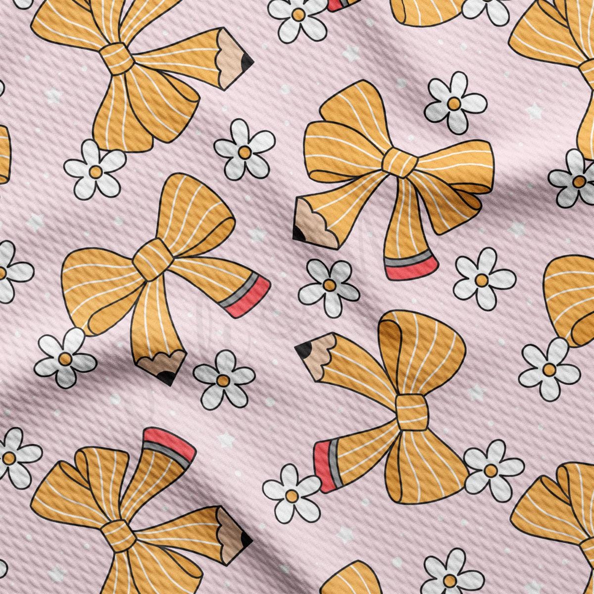 a pink background with yellow bows and white flowers