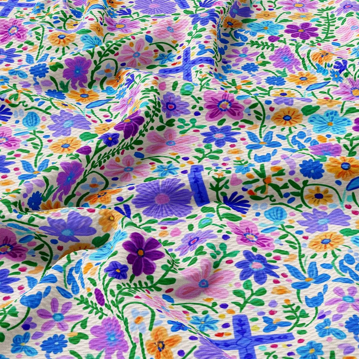 a close up of a colorful fabric with flowers on it