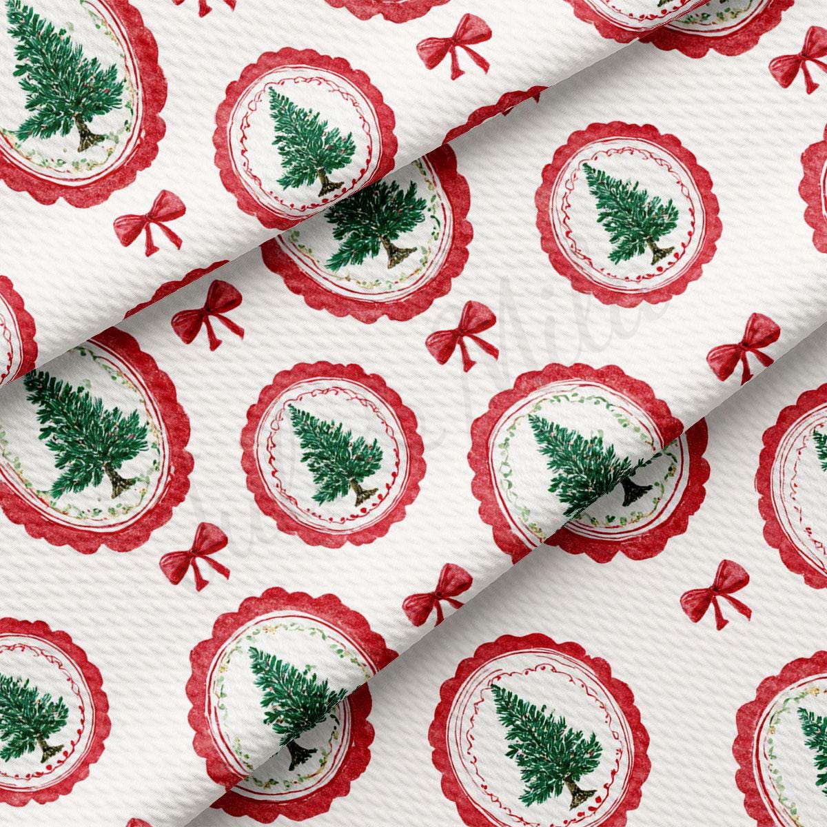 a repeating pattern of Christmas tree designs and red bows on a white background.