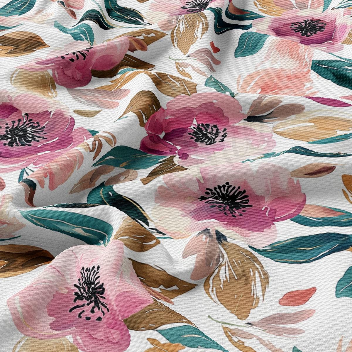 a close-up view of a fabric with a floral pattern. The fabric has a white background with pink and green flowers and leaves, creating a vibrant and colorful design.