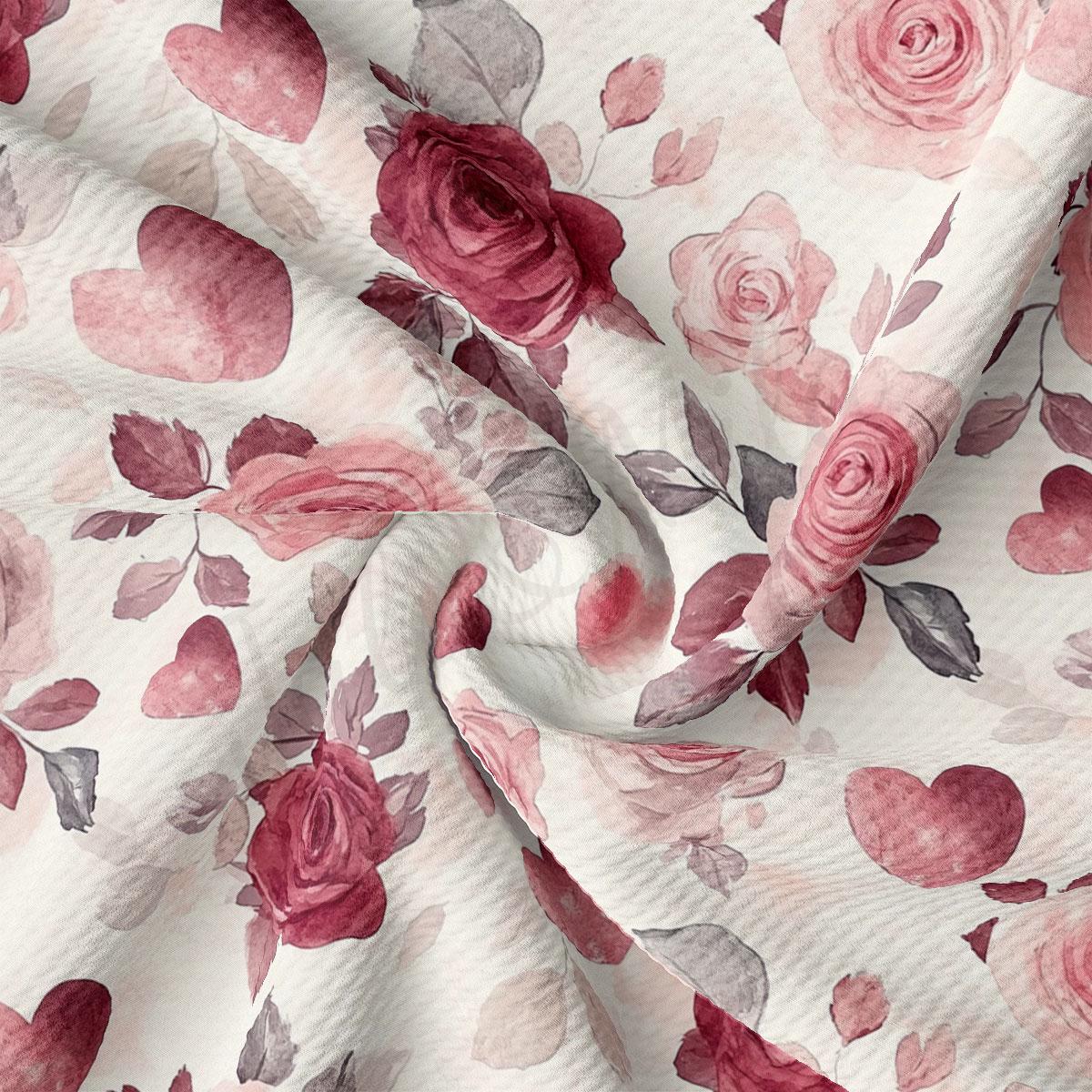 a close-up view of a fabric with a floral pattern of pink roses and hearts.