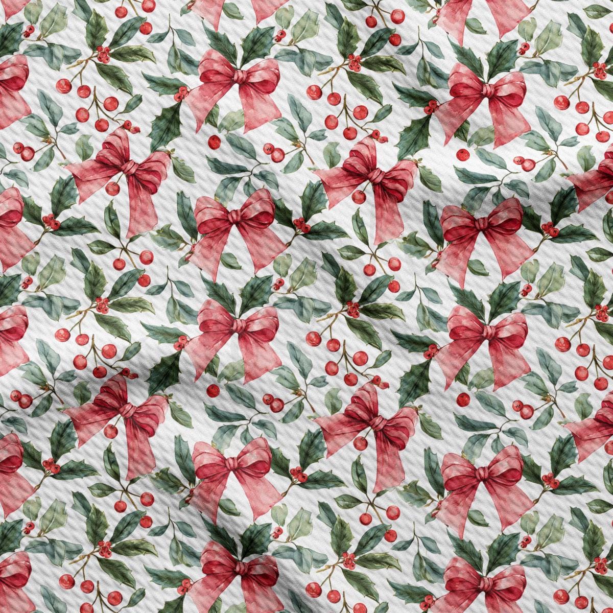 a repeating pattern of red bows, holly leaves, and berries on a white background.