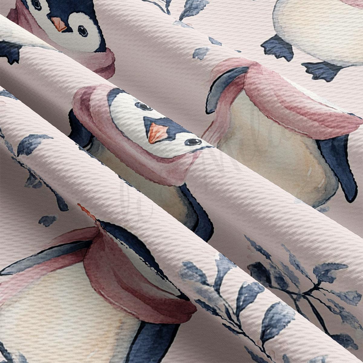 a close-up view of a fabric with a repeating pattern of penguins wearing pink scarves.