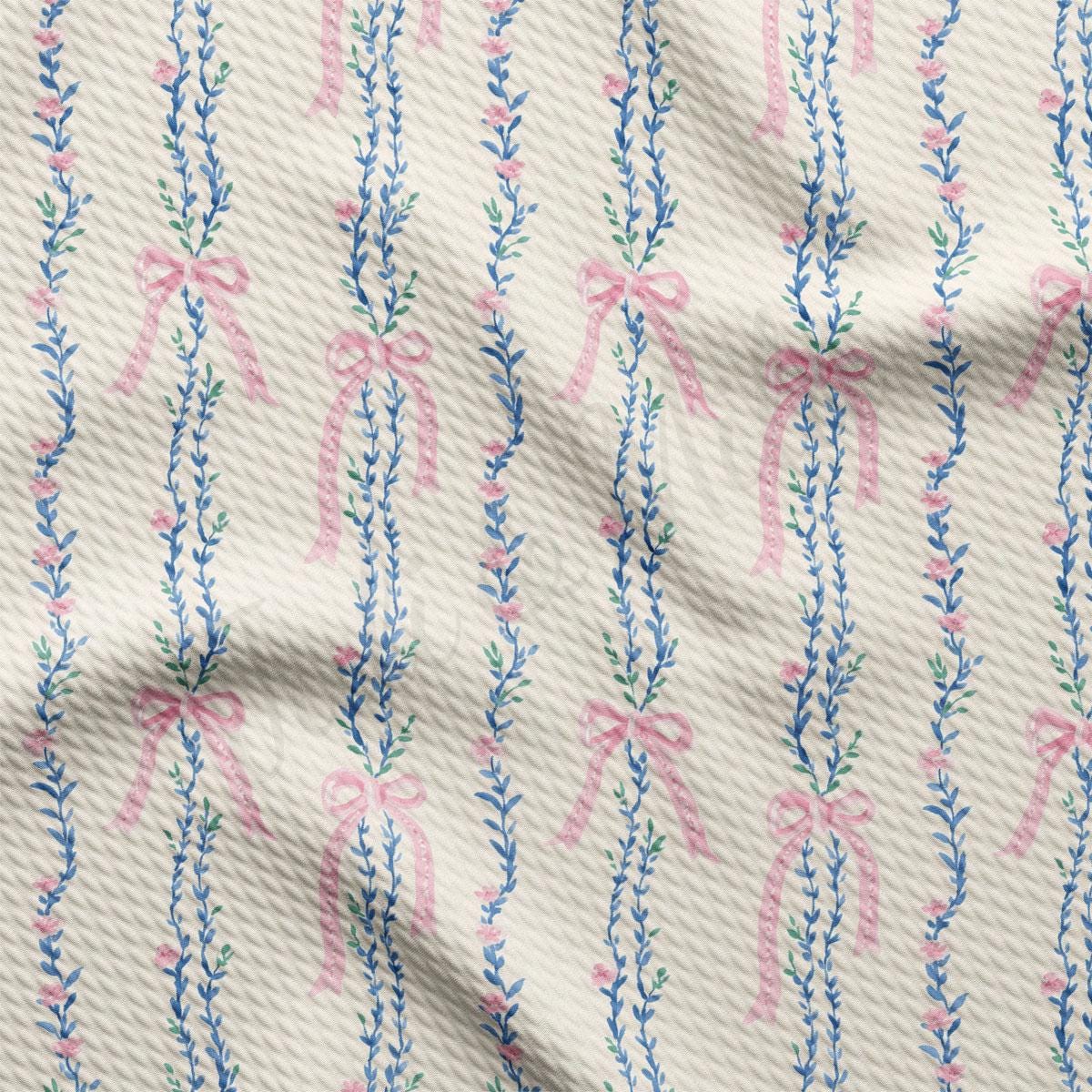 a repeating pattern of pink bows and blue leaves on a white background.