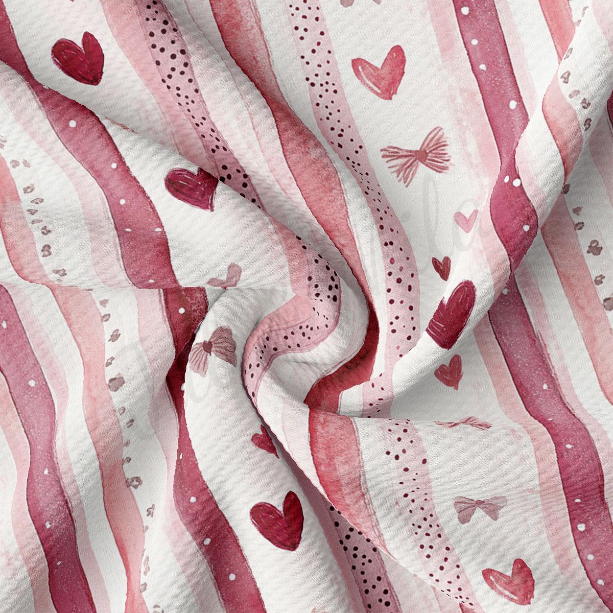The image is a close-up of a fabric with a repeating pattern of pink and white stripes, along with small red hearts scattered throughout the fabric.