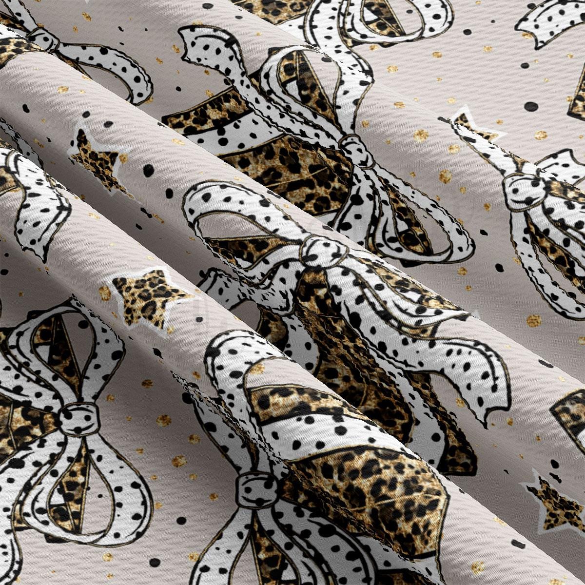 a close-up view of a fabric with a repeating pattern of leopard print and white polka dots. The pattern is composed of various shapes and sizes of leopard print elements, such as stars and bows, arranged in a diagonal direction across the fabric. The fabric appears to be a light-colored material, possibly a satin or a sheer fabric, with a textured surface. The pattern is visually striking and creates a sense of movement and energy.