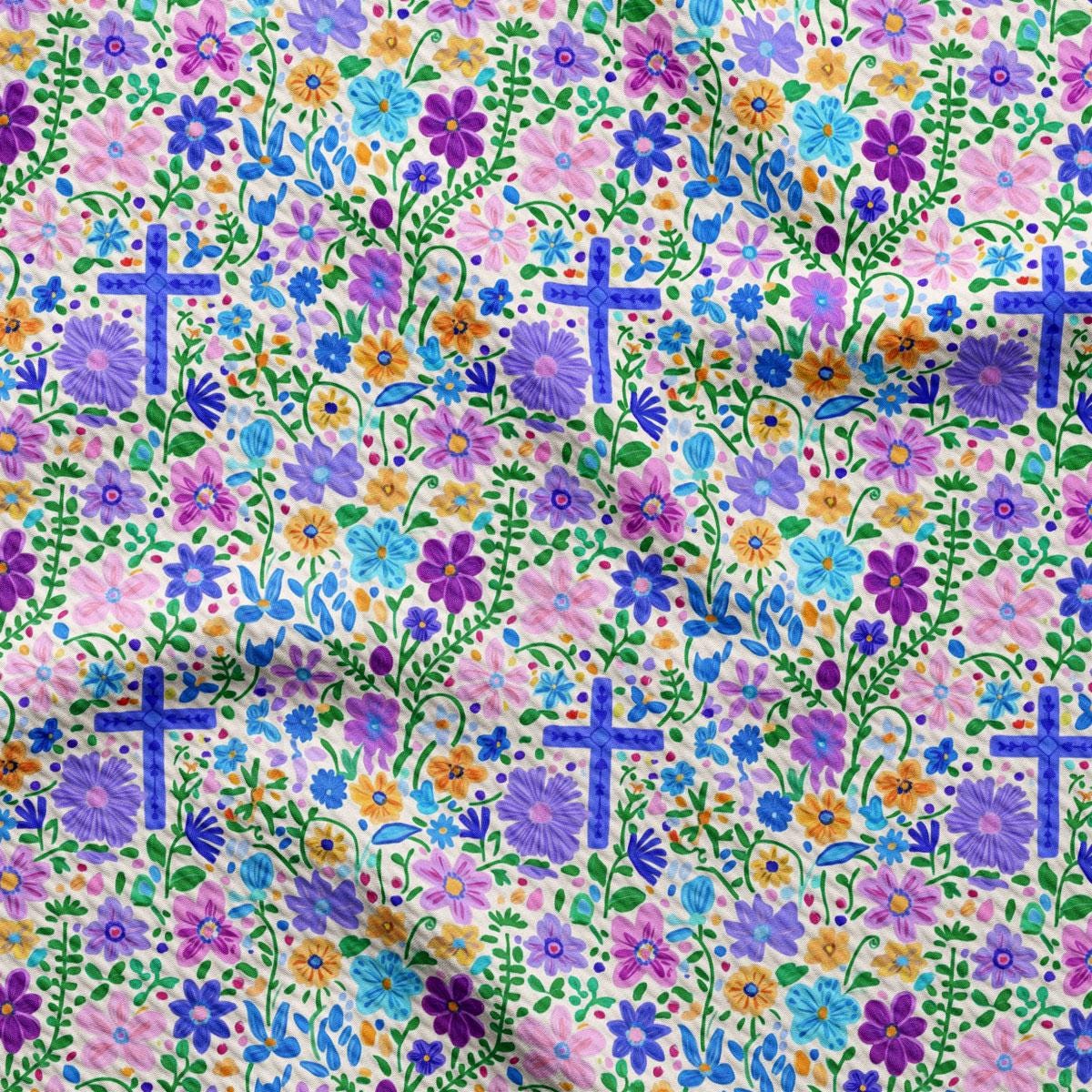 a colorful flowered fabric with crosses on it