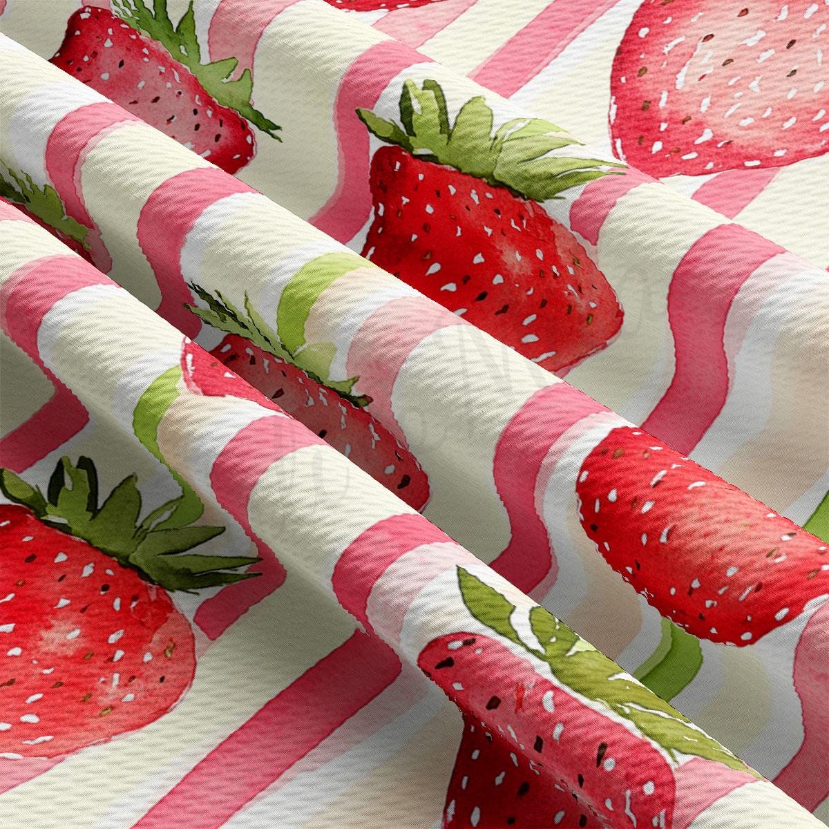 a close up of a pattern of strawberries