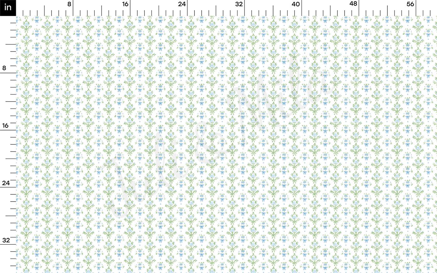 The image is a fabric with a repeating pattern of small blue and green flowers or leaves. The pattern is arranged in a grid-like fashion, creating a visually appealing and intricate design. The image does not contain any text or other discernible objects or actions.