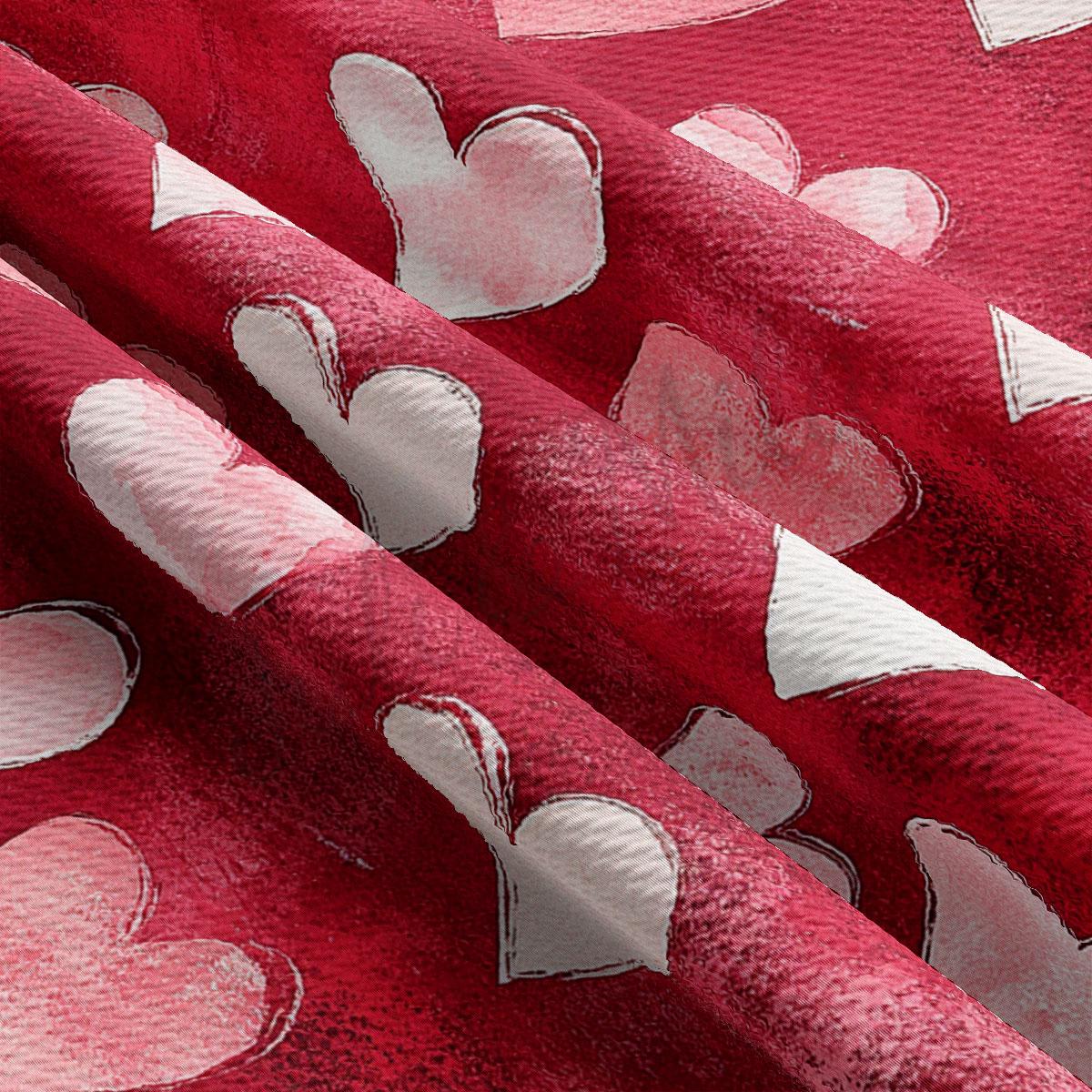a close-up view of a fabric with a repeating pattern of red hearts on a red background.