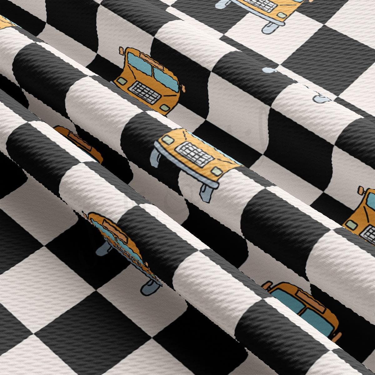 a black and white checkered table cloth with a yellow truck on it