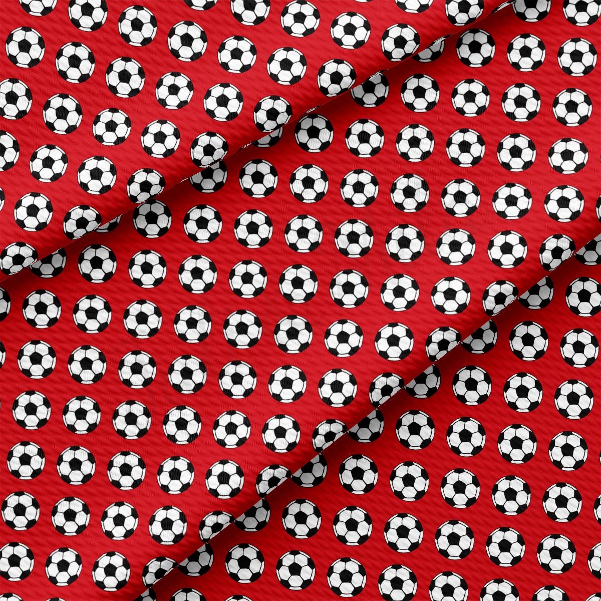 a red tie with soccer balls on it