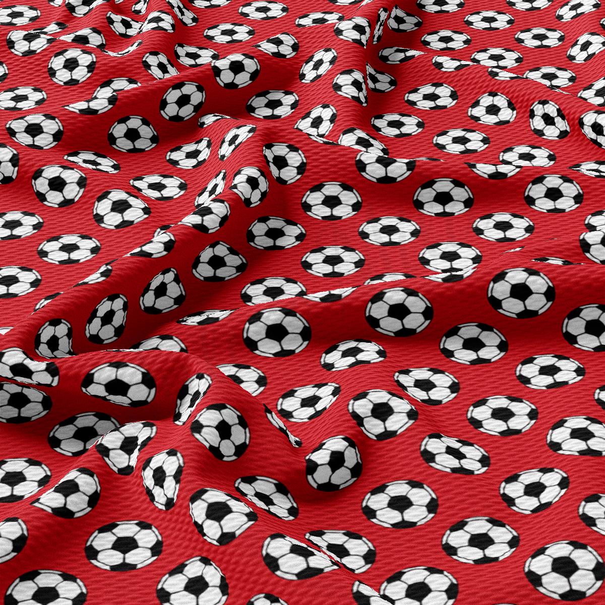 a red background with black and white soccer balls