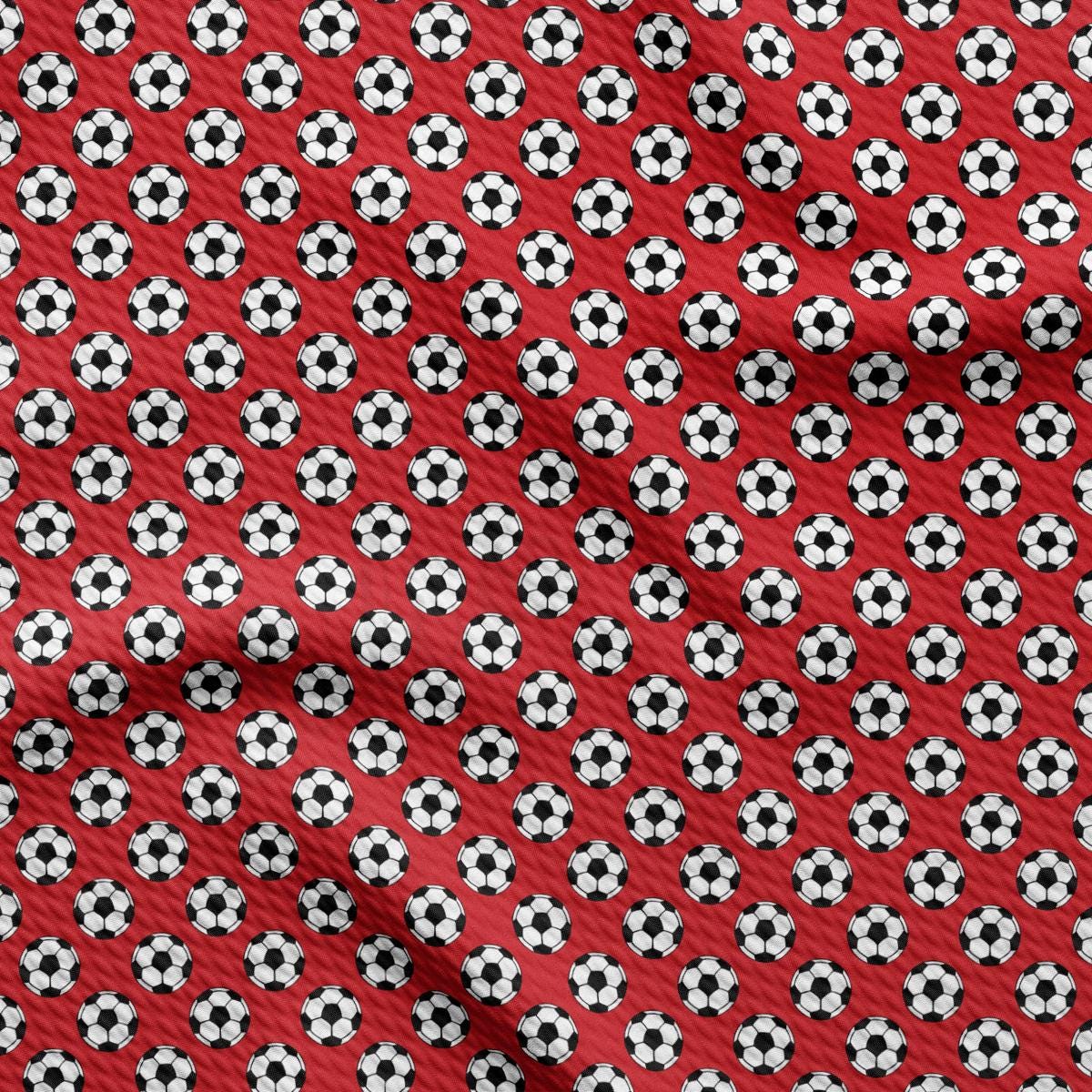 a red background with black and white soccer balls