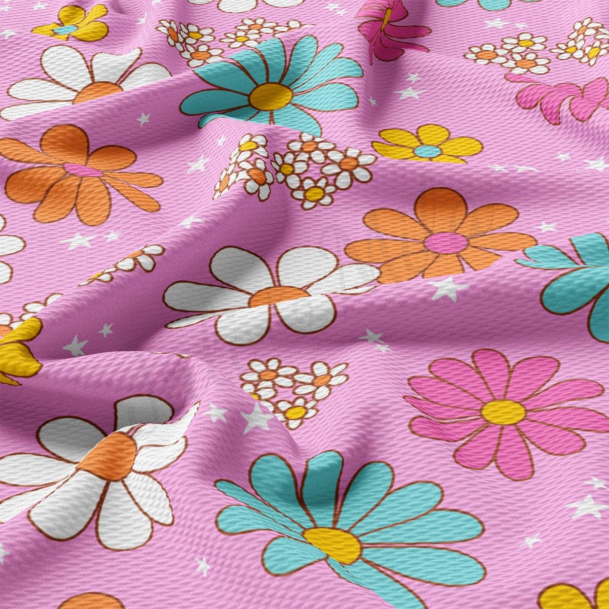 a close up of a pink flowered fabric