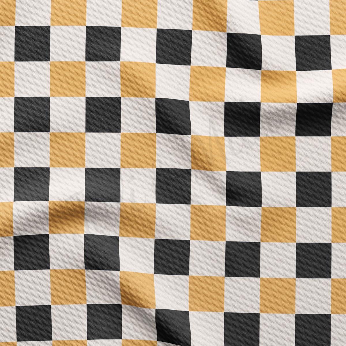 a black and yellow checkered fabric is shown