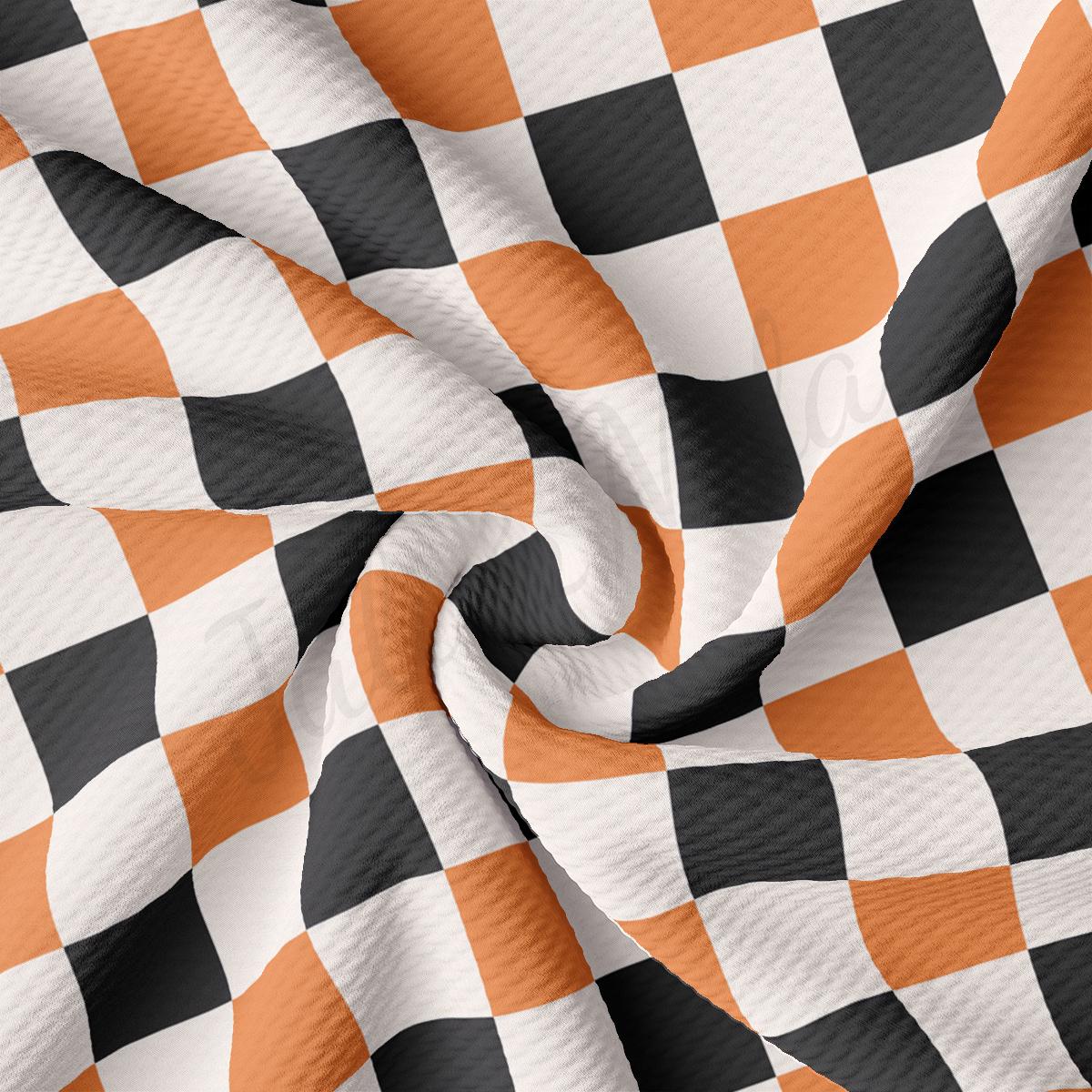 a checkered fabric with an orange and black pattern