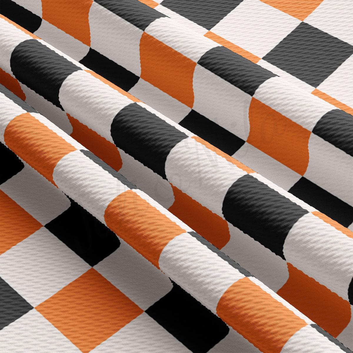 a close up of an orange and white checkered fabric