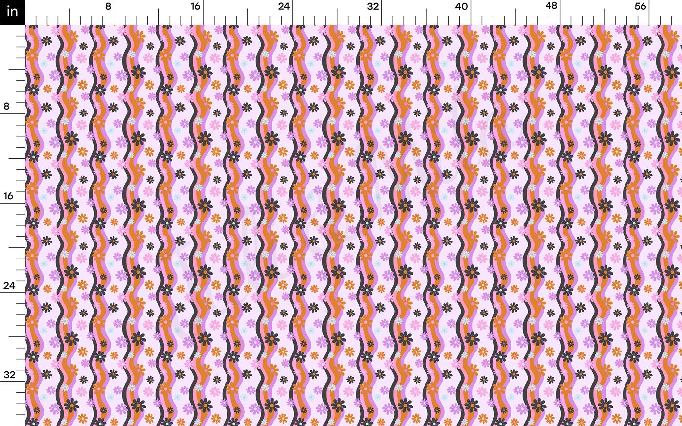 a ruler with a pink and orange pattern on it