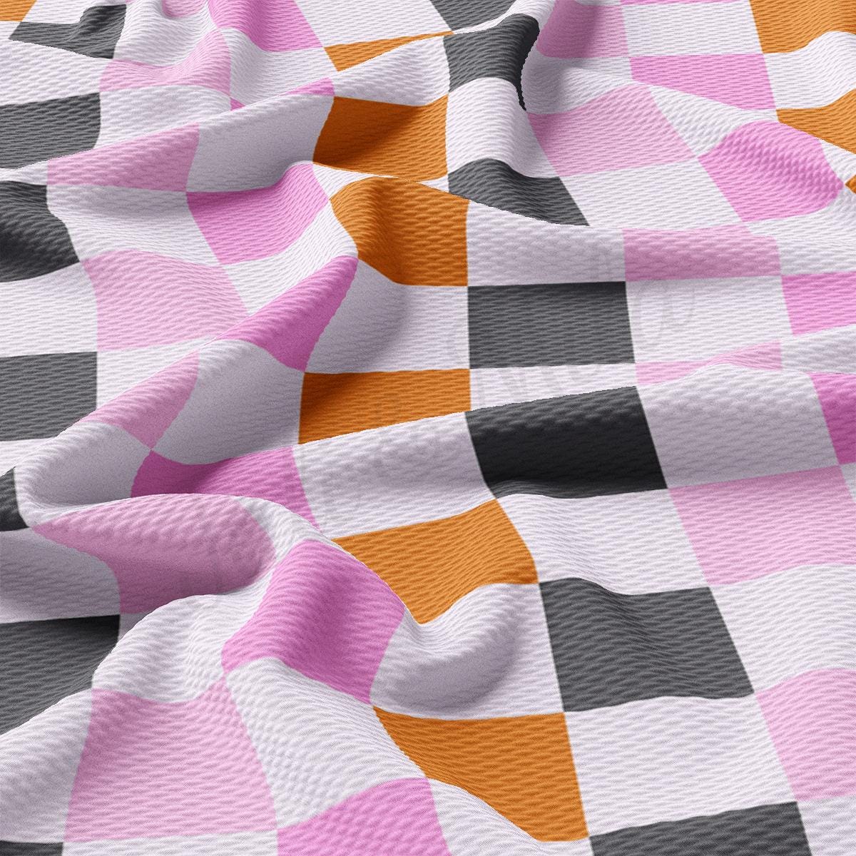a close up of a pink and black checkered fabric