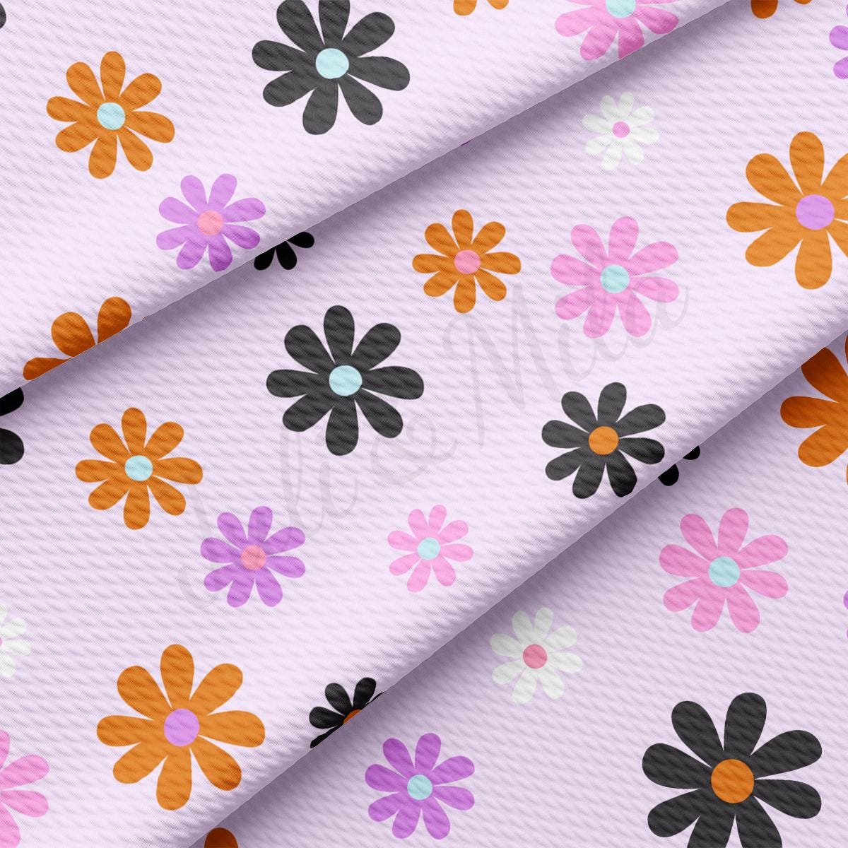 a close up of a flower print on a pink background
