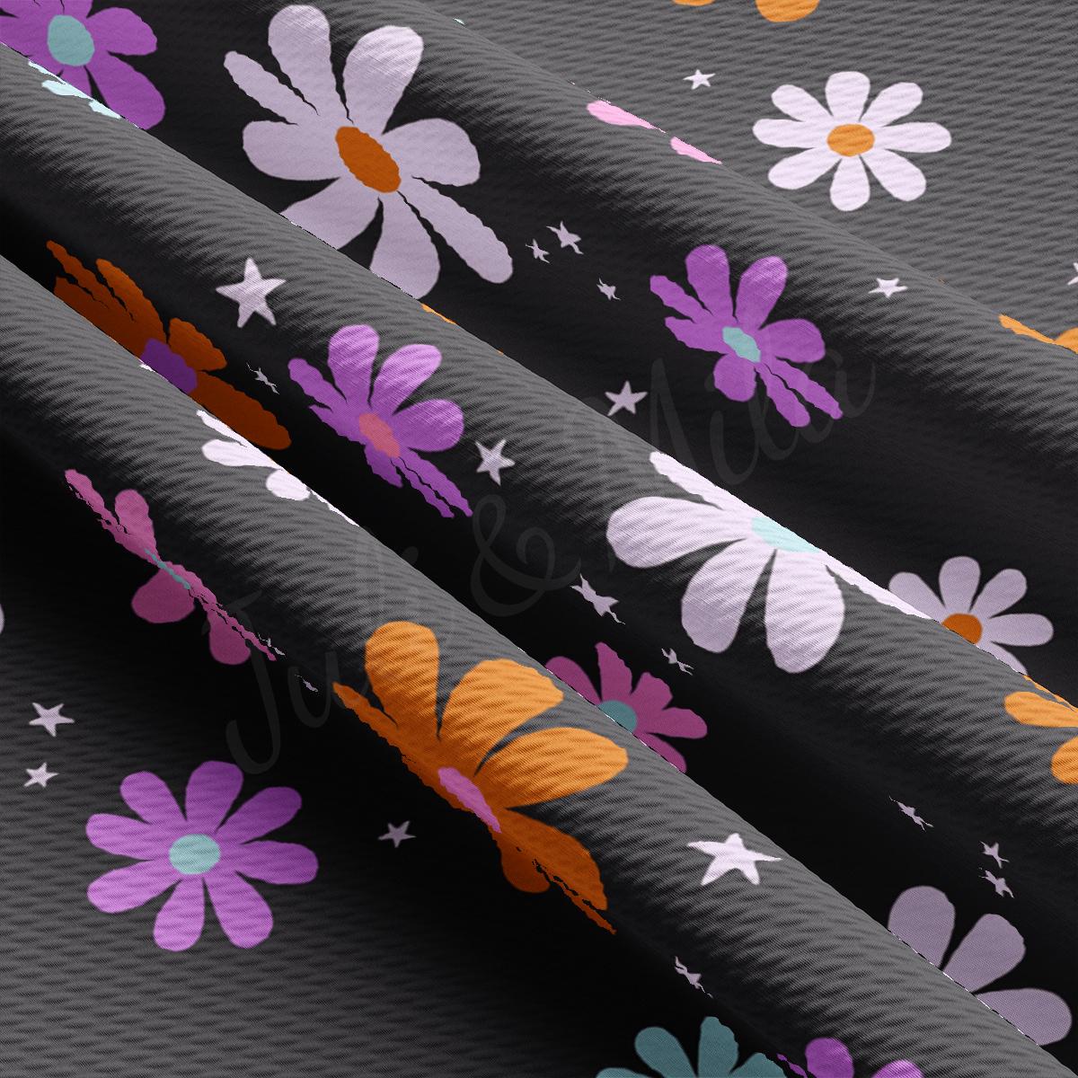 a pattern of flowers and stars on a black background