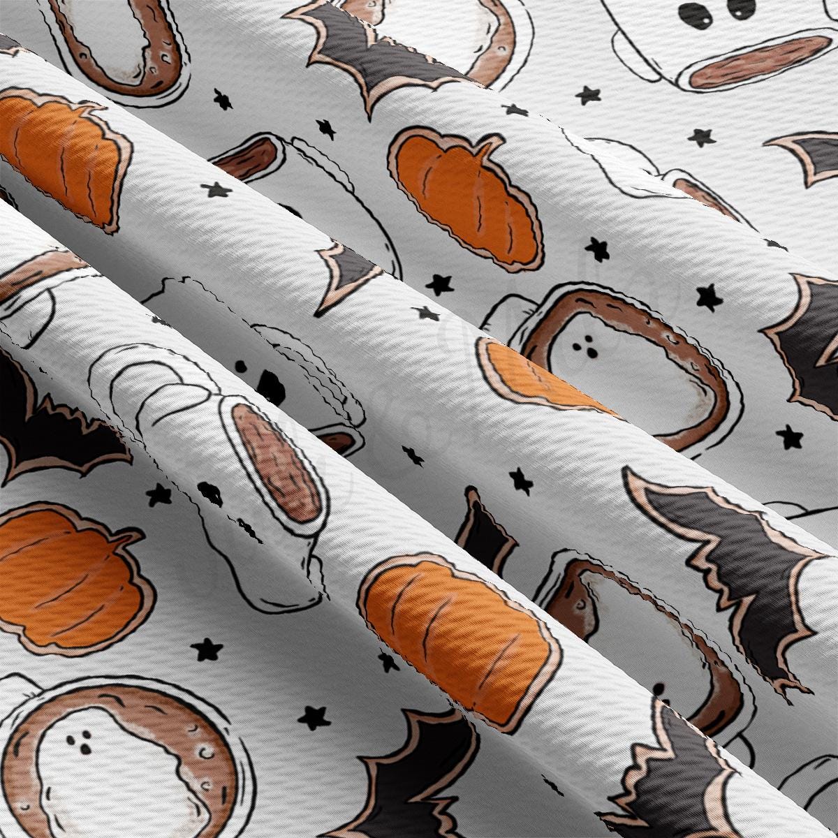 a close up of a pattern of pumpkins