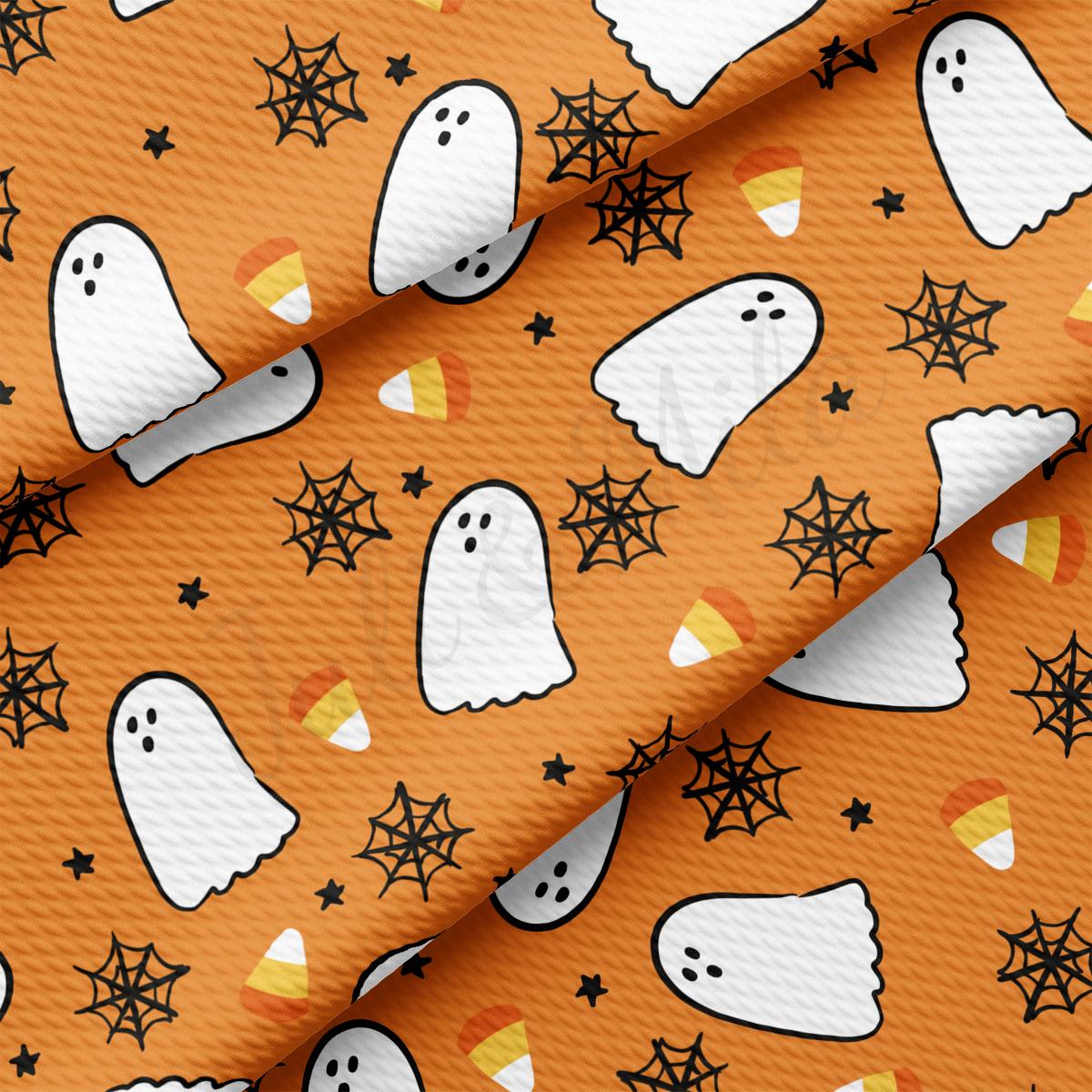 a pattern of ghost and stars on an orange background