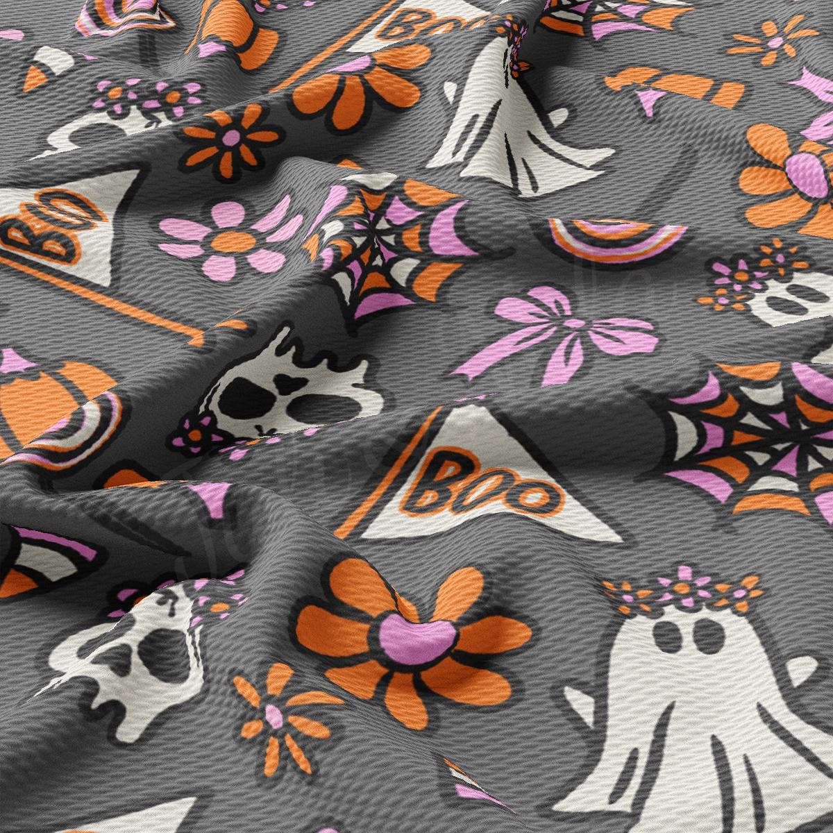 a close up of a fabric with skulls and flowers on it