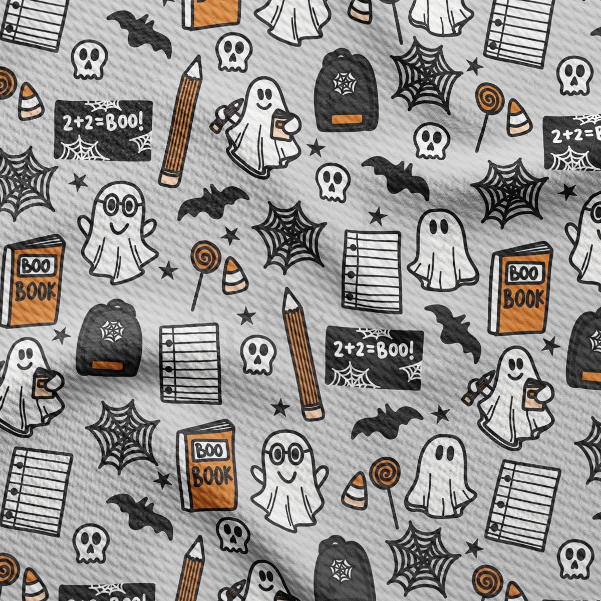 a pattern of halloween themed items on a gray background