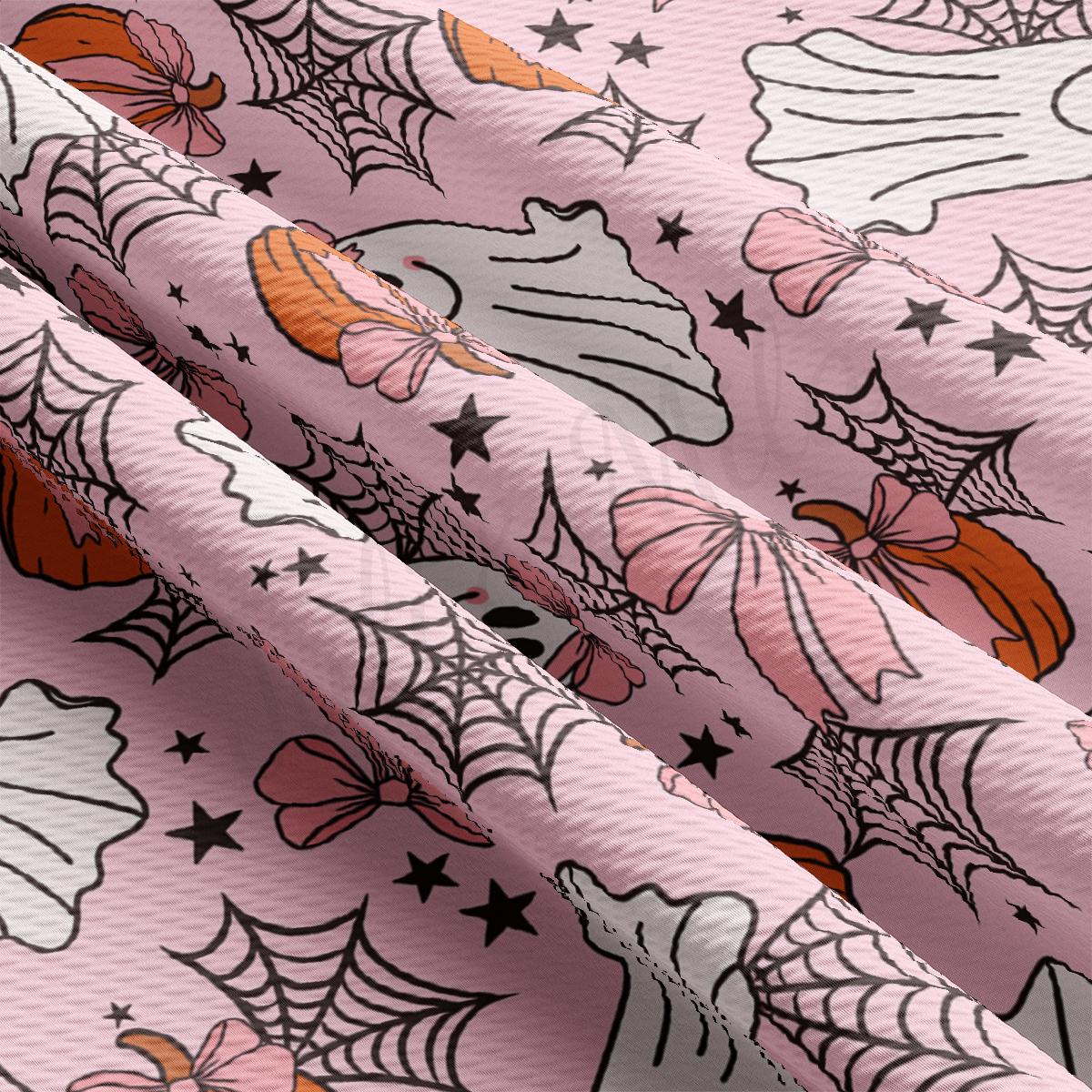 a close up of a pink background with spider webs