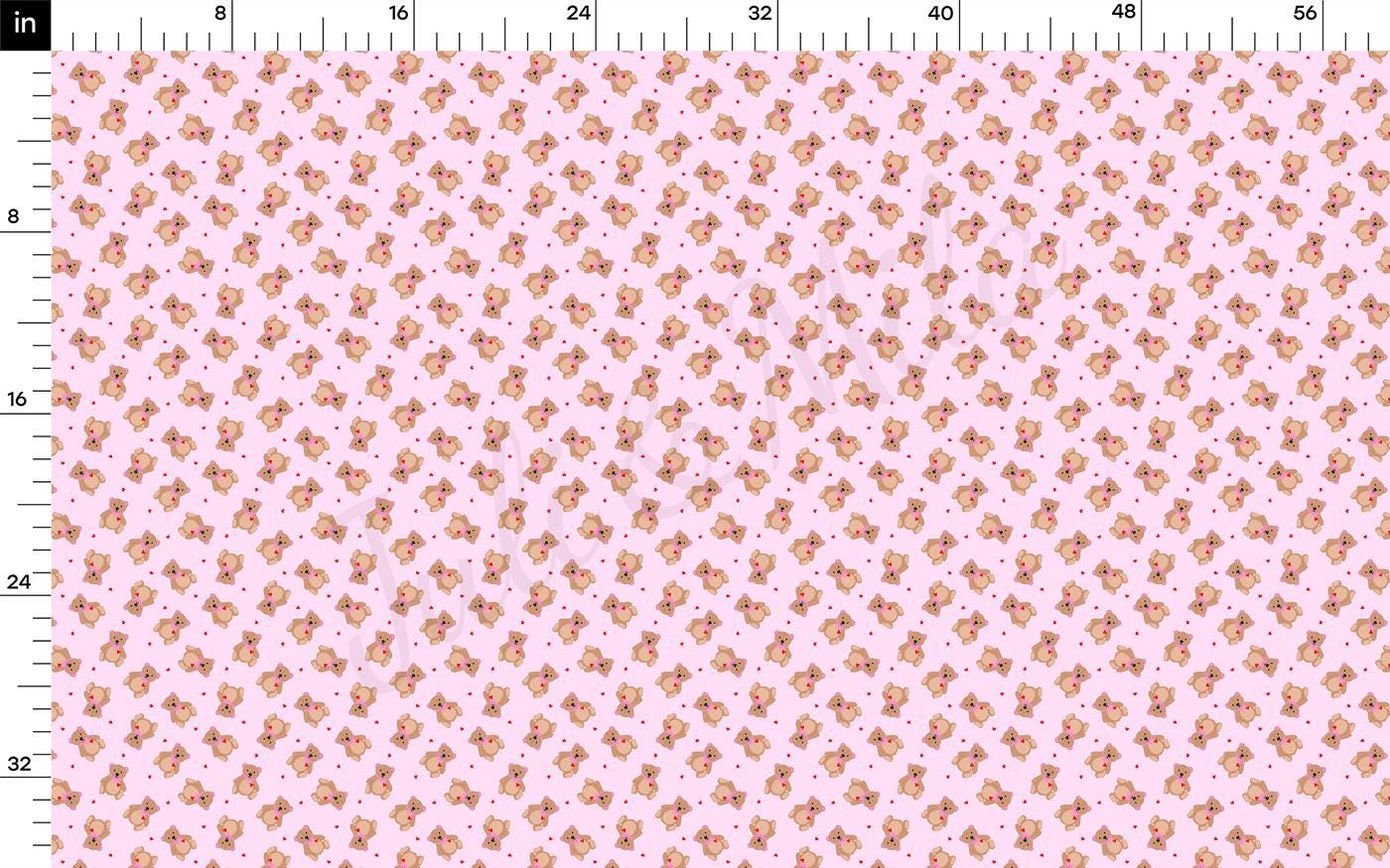 a ruler with a pink and gold pattern on it