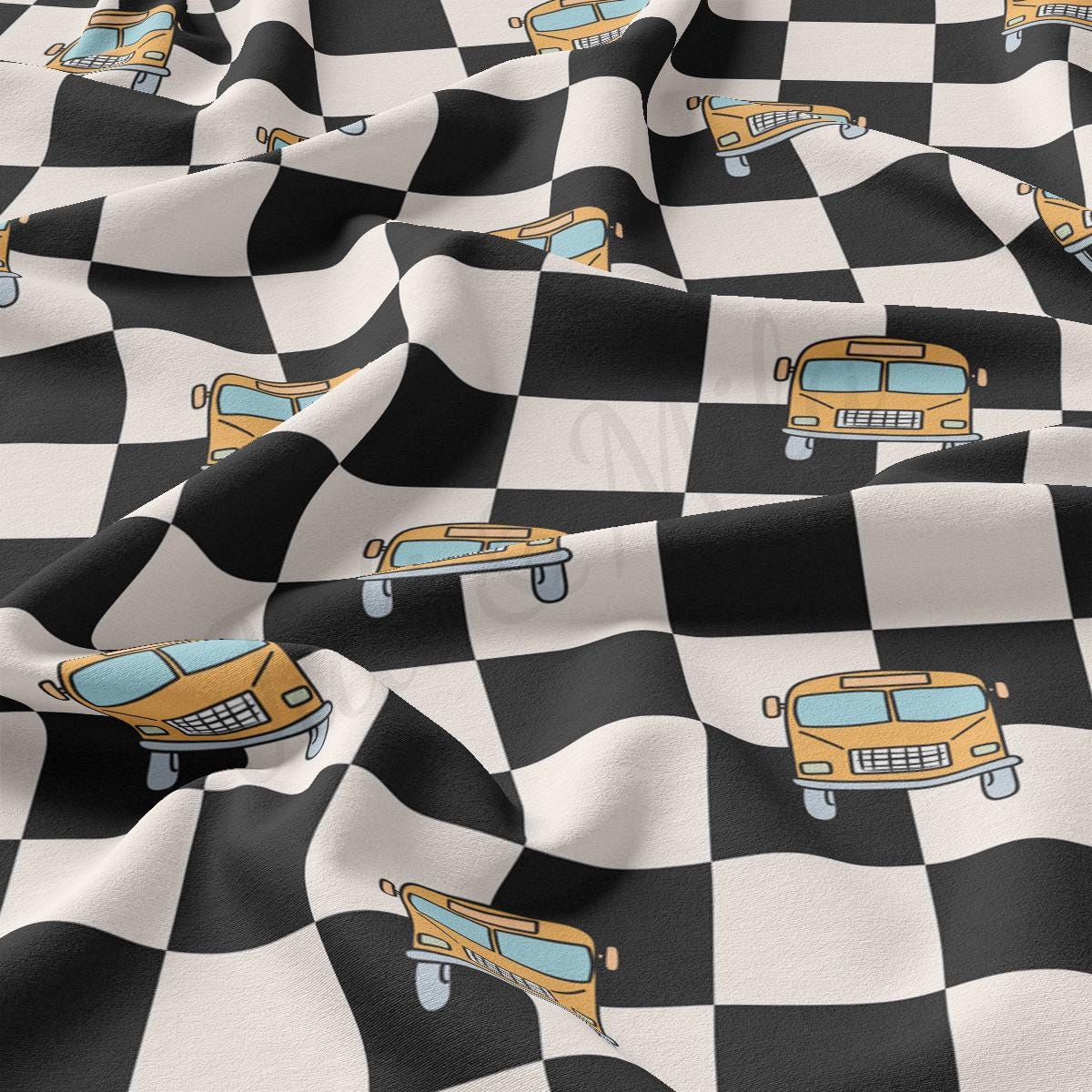 a black and white checkered fabric with cars on it