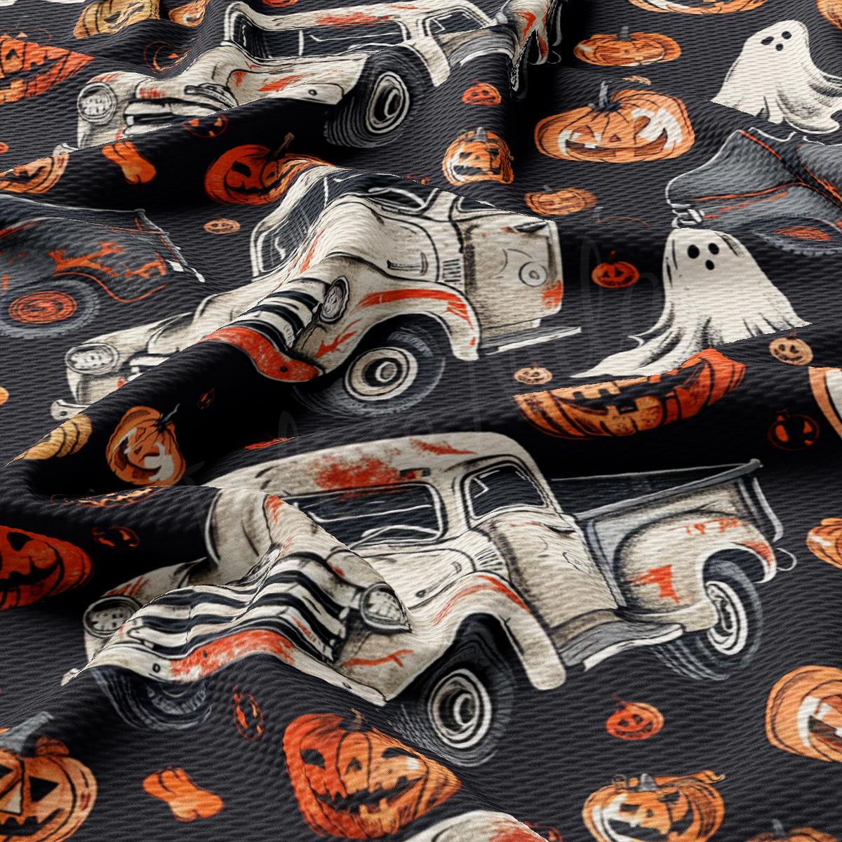 a close up of a tie with a car and pumpkins on it