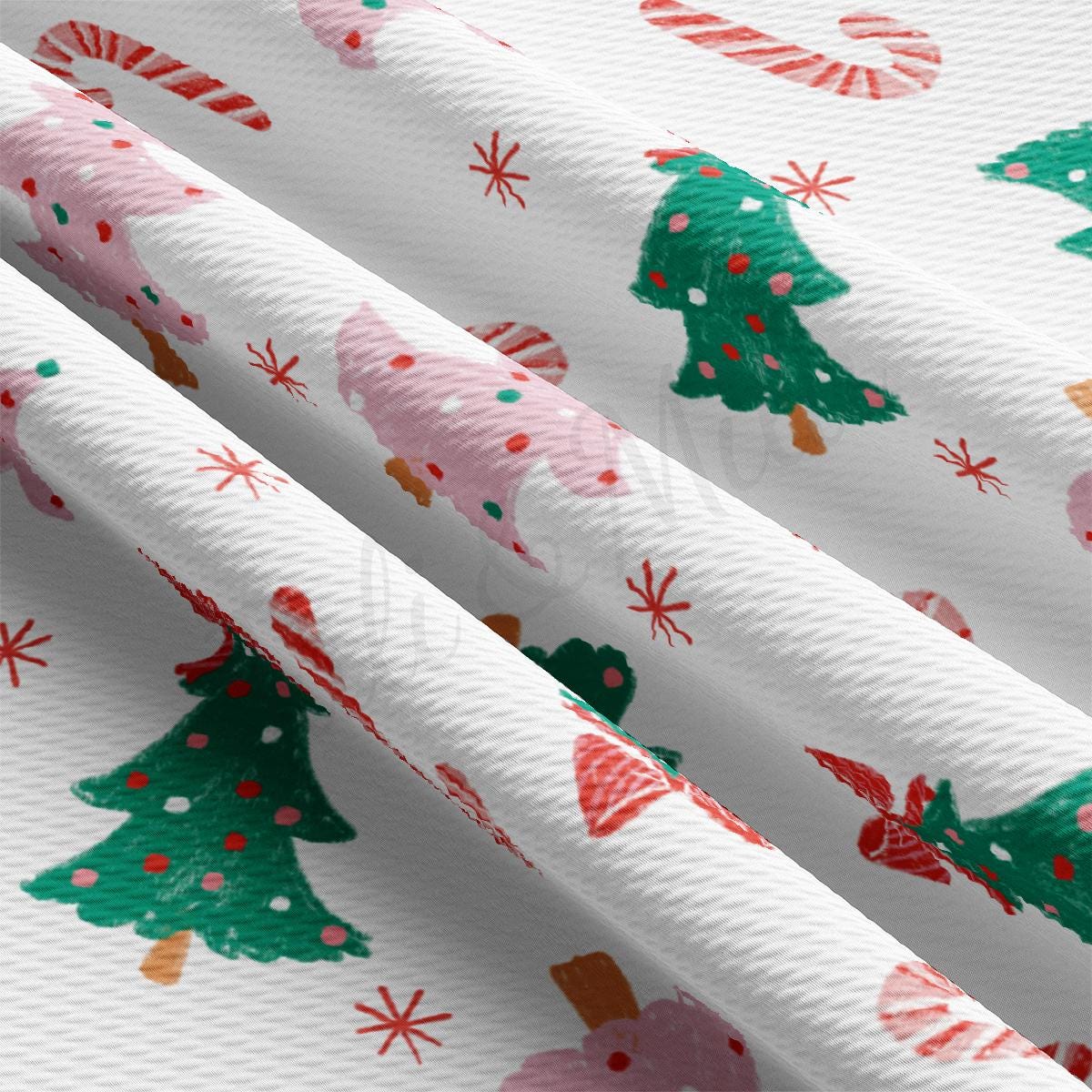 a white wrapping paper with christmas trees on it