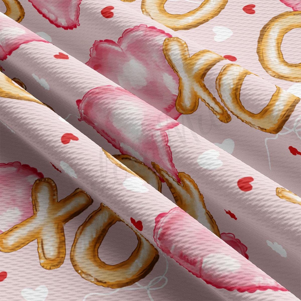 a close up of a pink background with gold lettering
