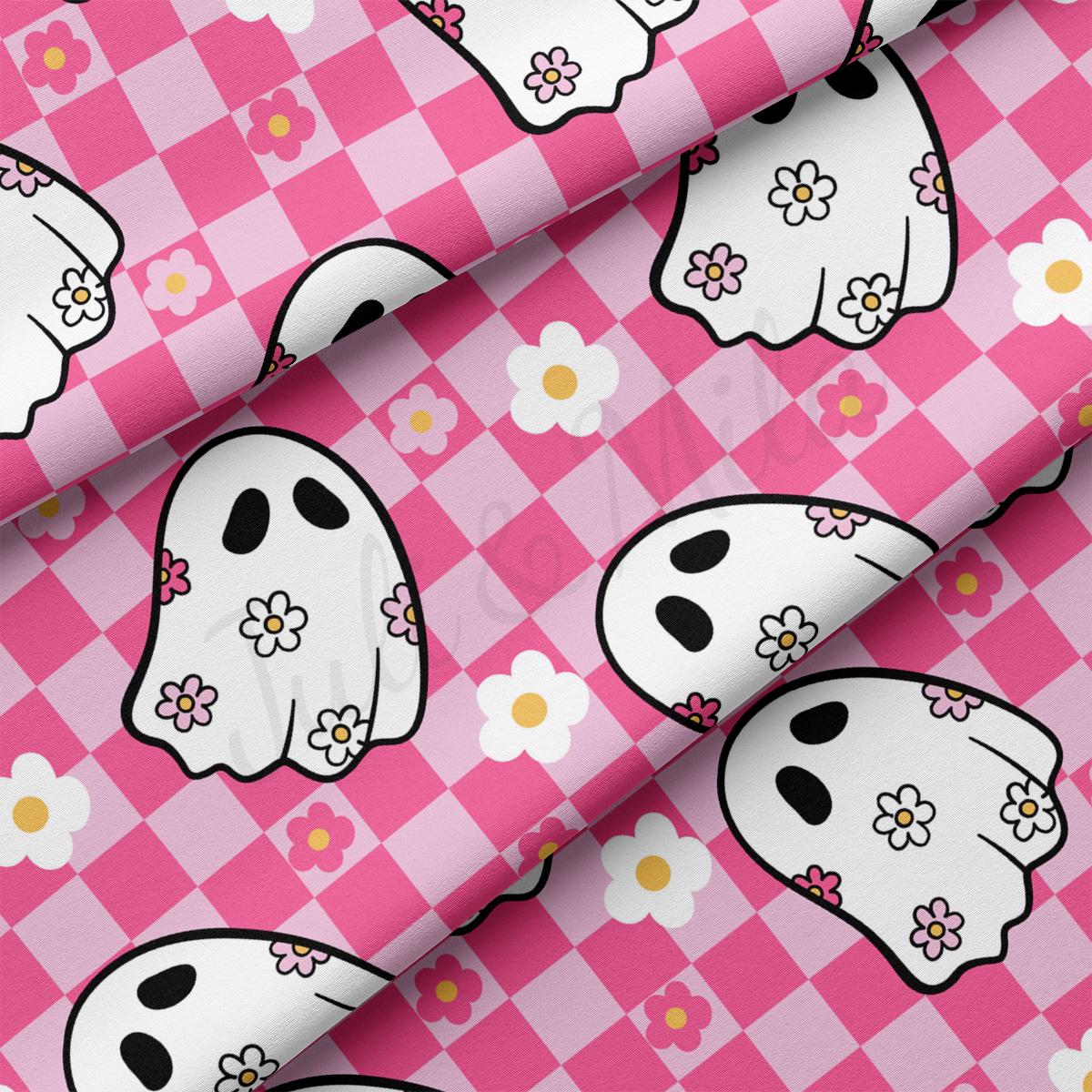 a pink and white pattern with a ghost on it