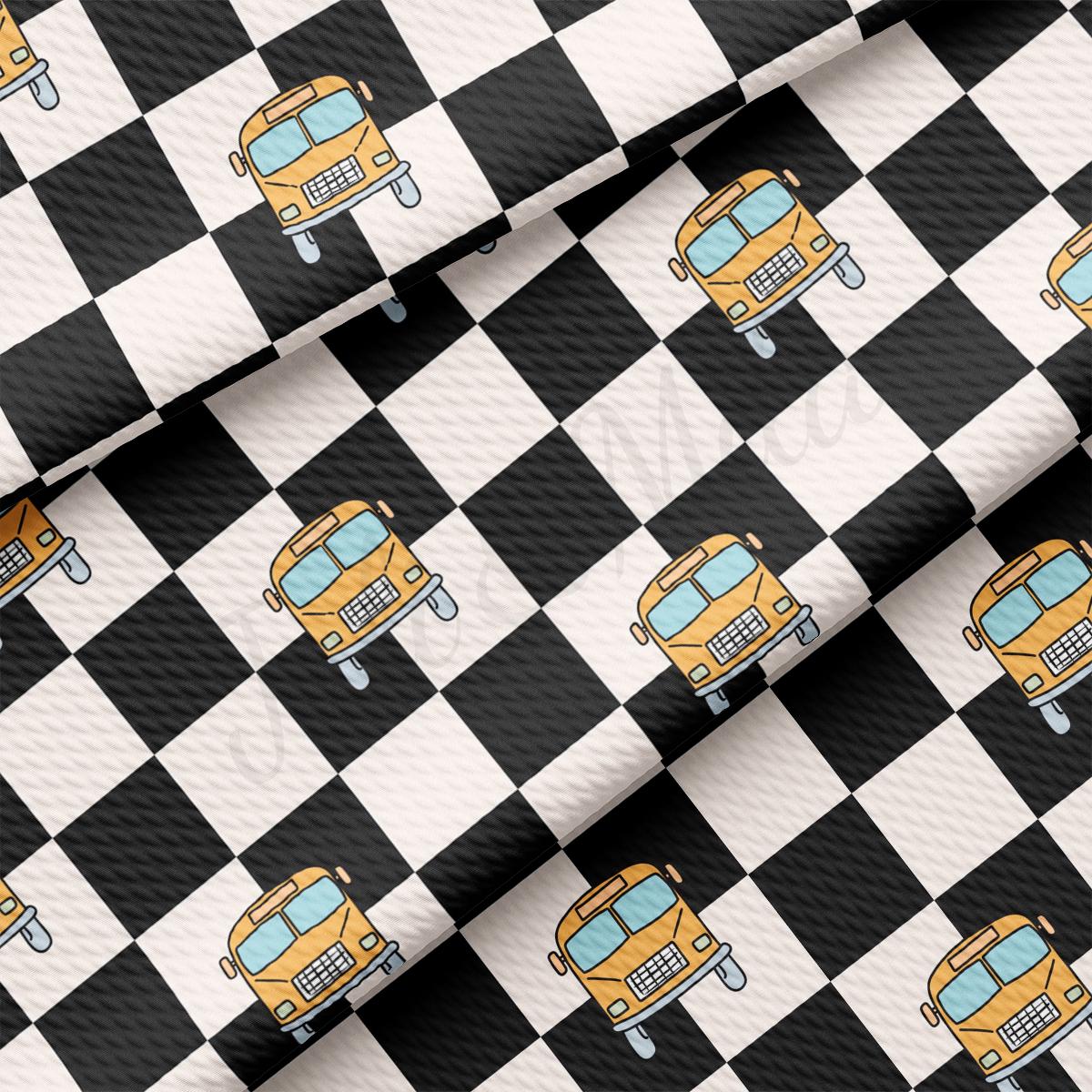 a black and white checkered pattern with a yellow truck on it