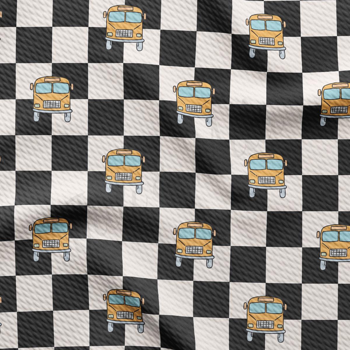 a black and white checkered background with a yellow school bus