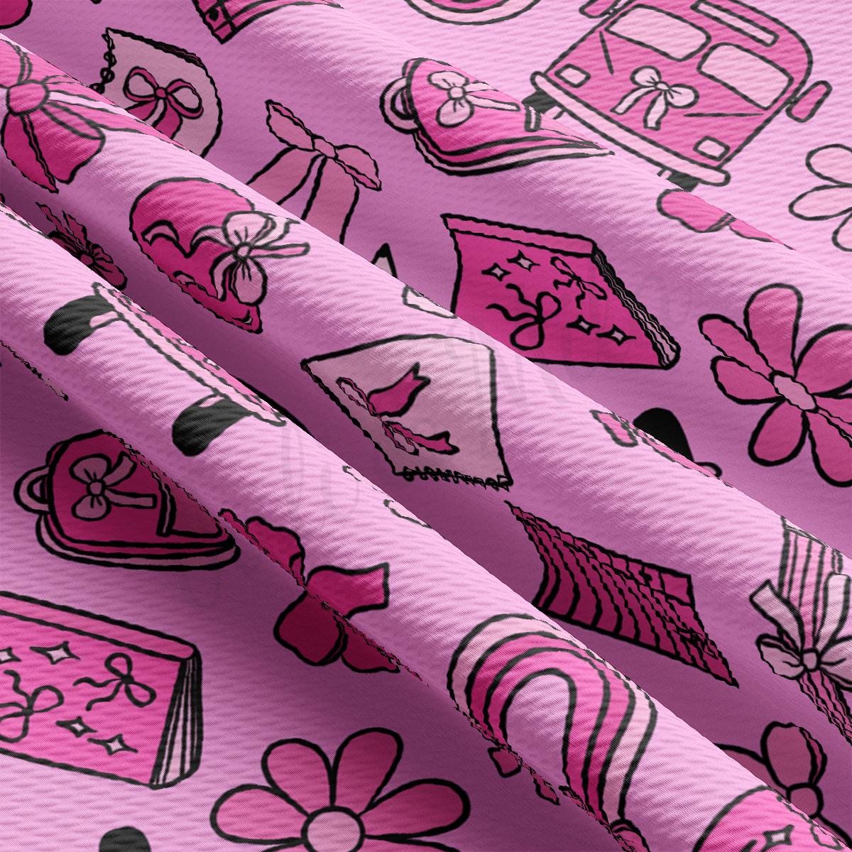 a close up of a pink fabric with pink and black designs