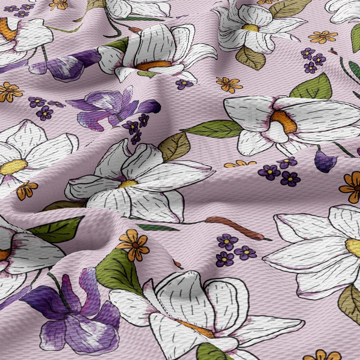 a close up of a pink flowered fabric