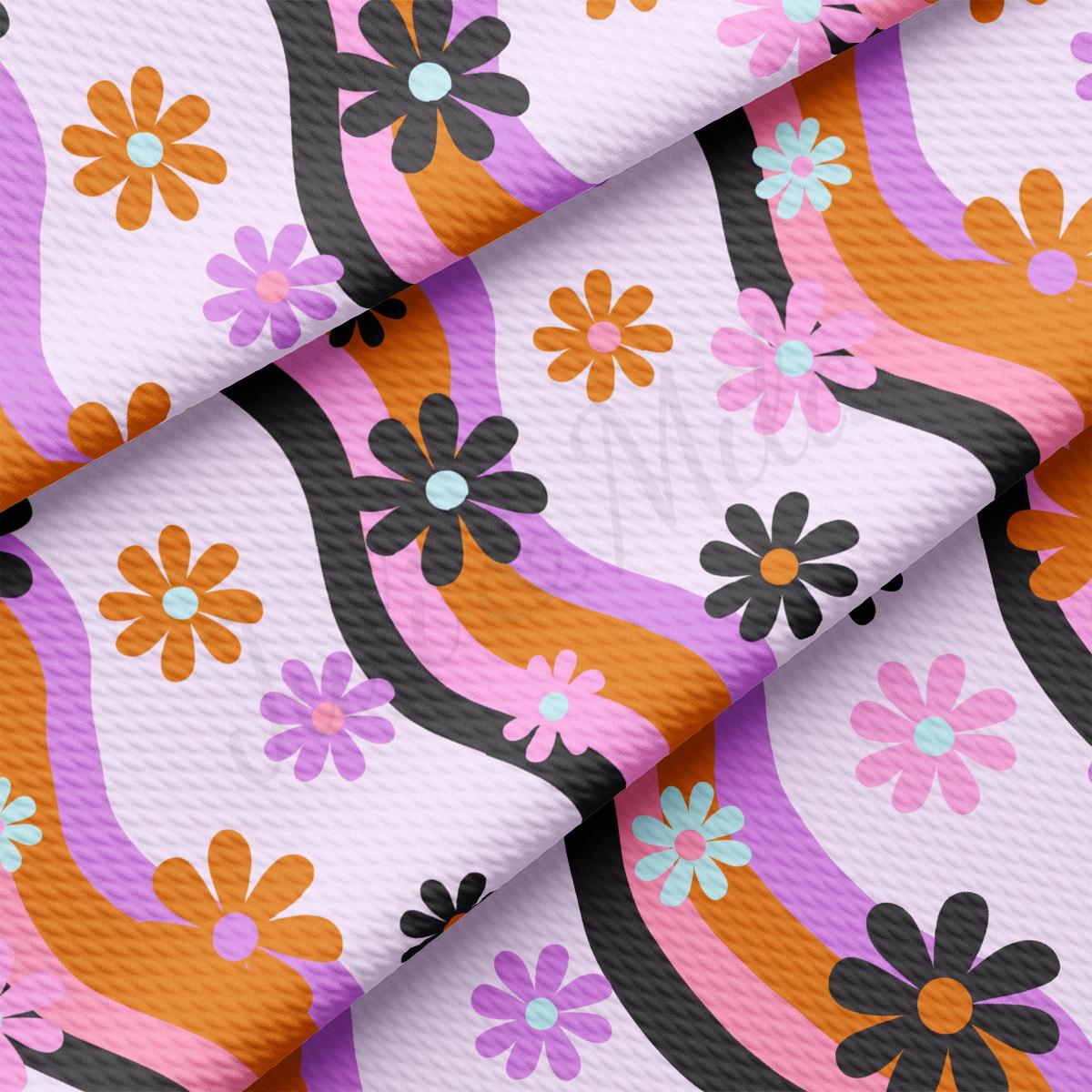 a close up of a pink and orange flowered fabric
