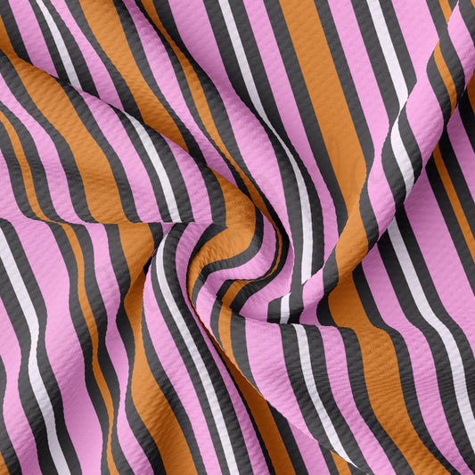 a close up of a pink and black striped fabric