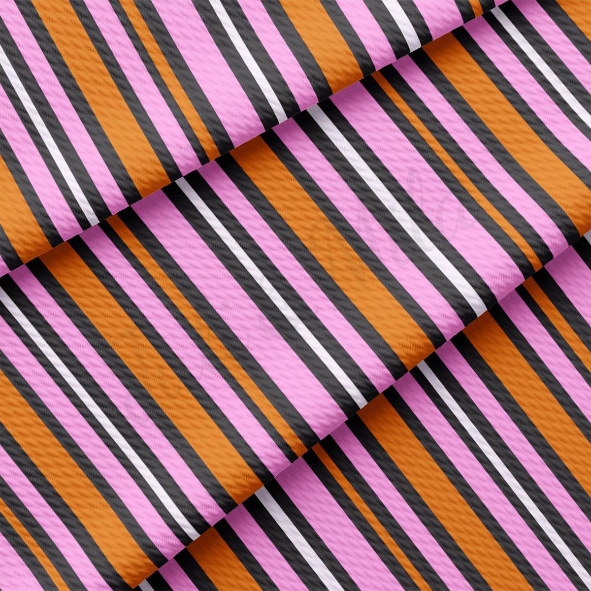 a close up of a pink and black striped fabric