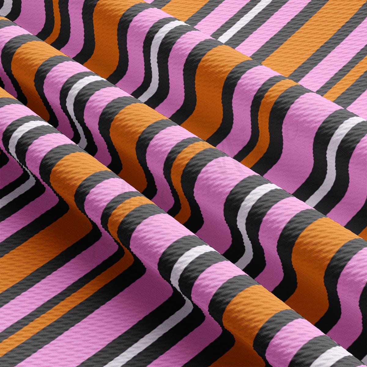 a close up of a pink, black, and orange striped material